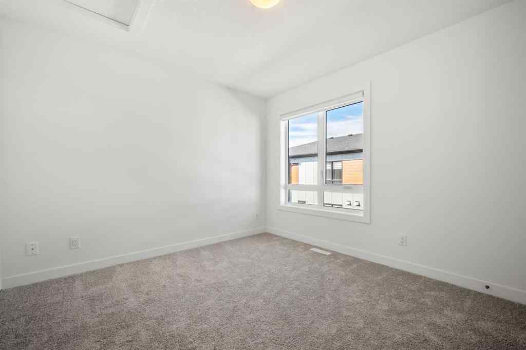 MLS® A2262499 - Unit #116 8235 8 Avenue SW in West Springs Calgary, Residential