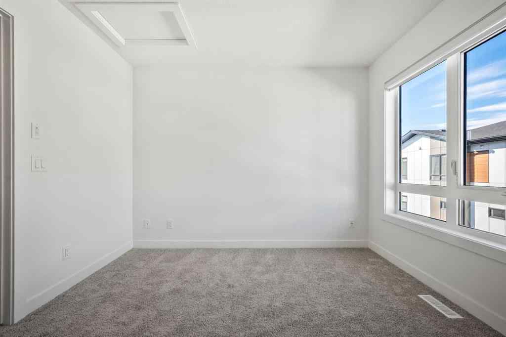 MLS® A2262499 - Unit #116 8235 8 Avenue SW in West Springs Calgary, Residential