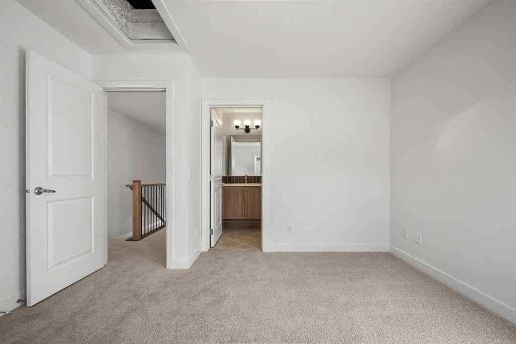 MLS® A2262501 - 8331 8 Avenue SW in West Springs Calgary, Residential