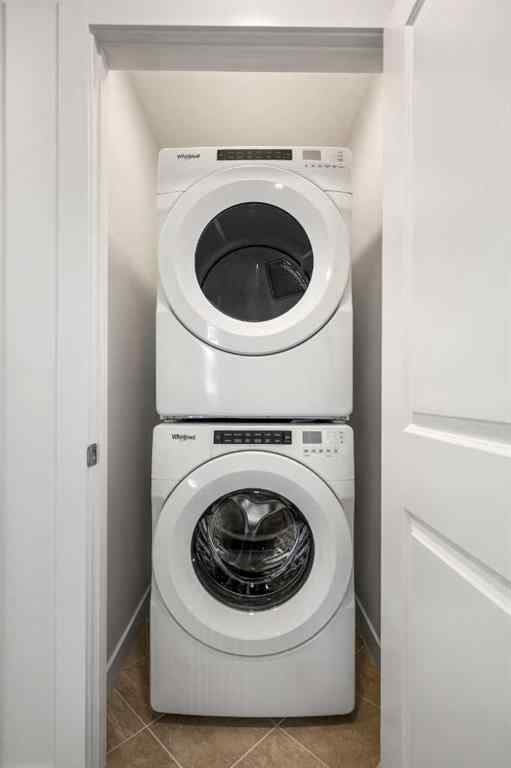 MLS® A2262501 - 8331 8 Avenue SW in West Springs Calgary, Residential