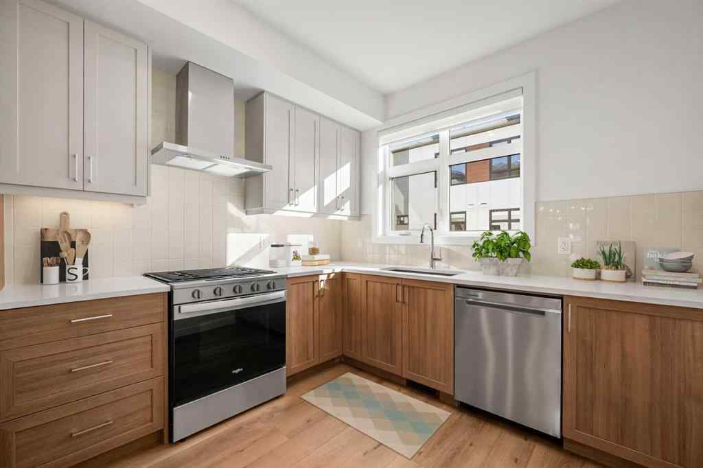 MLS® A2262501 - 8331 8 Avenue SW in West Springs Calgary, Residential