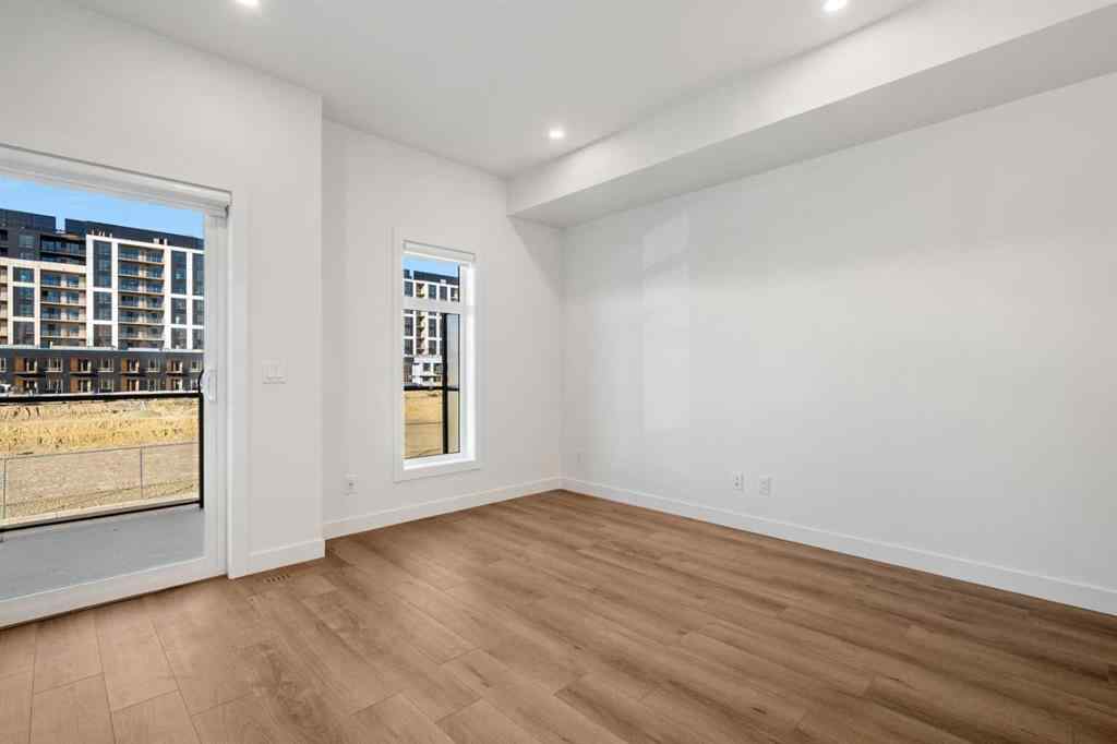 MLS® A2262501 - 8331 8 Avenue SW in West Springs Calgary, Residential