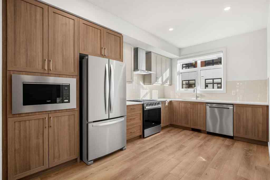 MLS® A2262501 - 8331 8 Avenue SW in West Springs Calgary, Residential