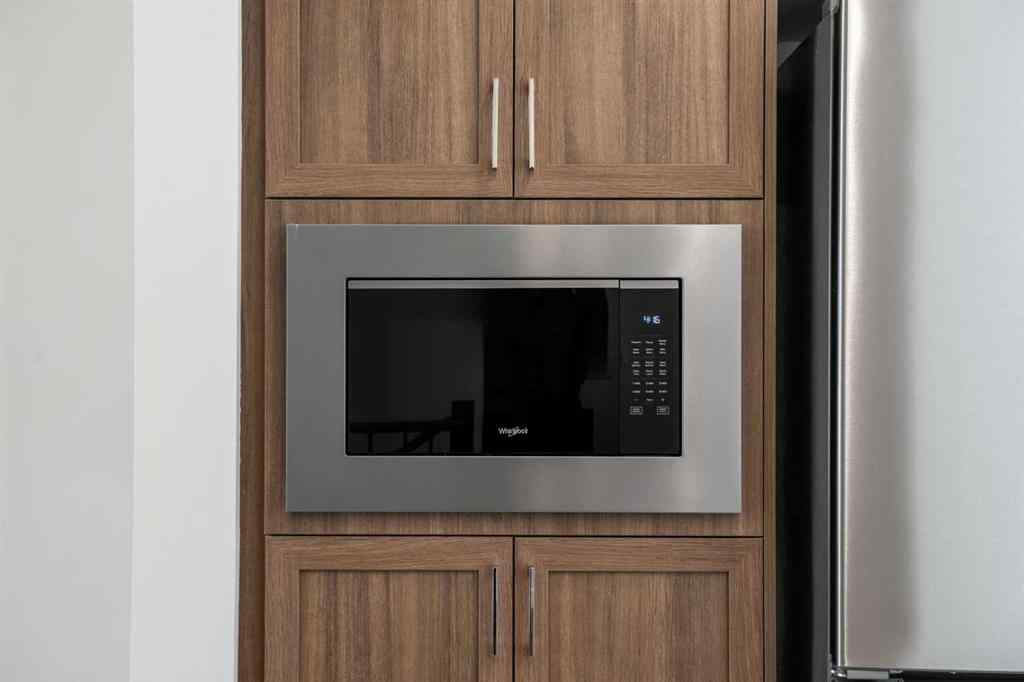 MLS® A2262501 - 8331 8 Avenue SW in West Springs Calgary, Residential