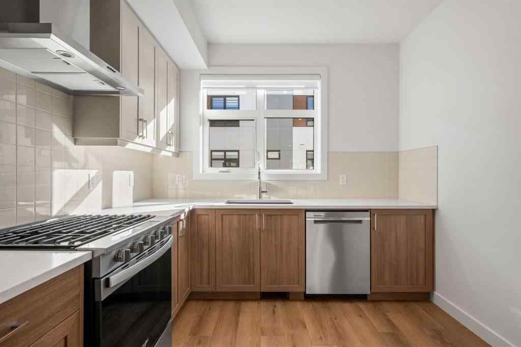 MLS® A2262501 - 8331 8 Avenue SW in West Springs Calgary, Residential