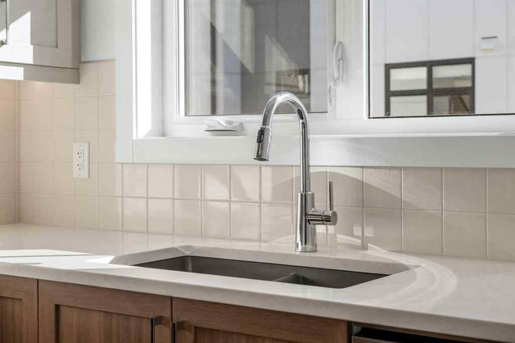 MLS® A2262501 - 8331 8 Avenue SW in West Springs Calgary, Residential