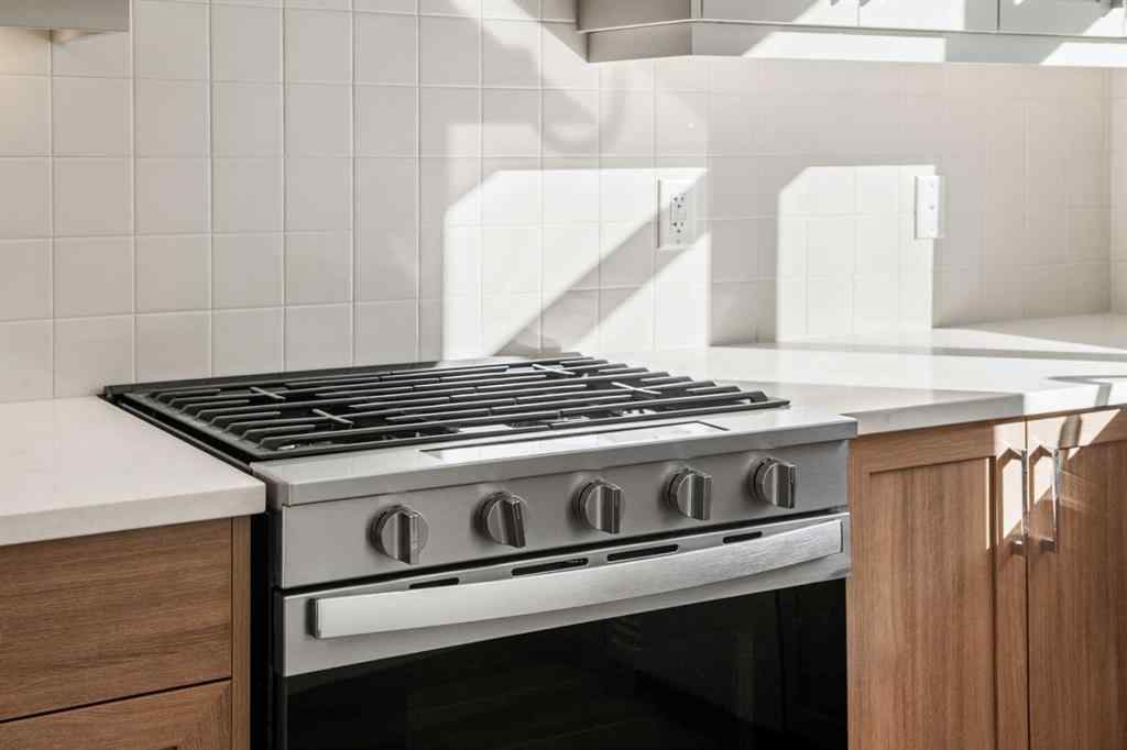 MLS® A2262501 - 8331 8 Avenue SW in West Springs Calgary, Residential