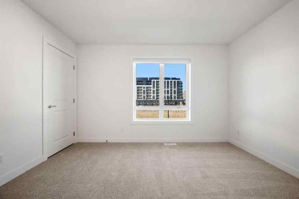 MLS® A2262501 - 8331 8 Avenue SW in West Springs Calgary, Residential