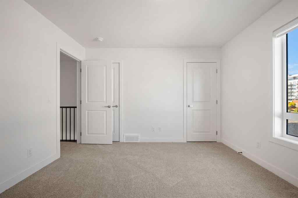 MLS® A2262501 - 8331 8 Avenue SW in West Springs Calgary, Residential