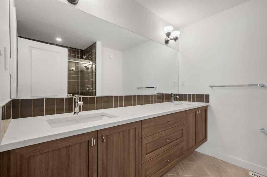 MLS® A2262501 - 8331 8 Avenue SW in West Springs Calgary, Residential