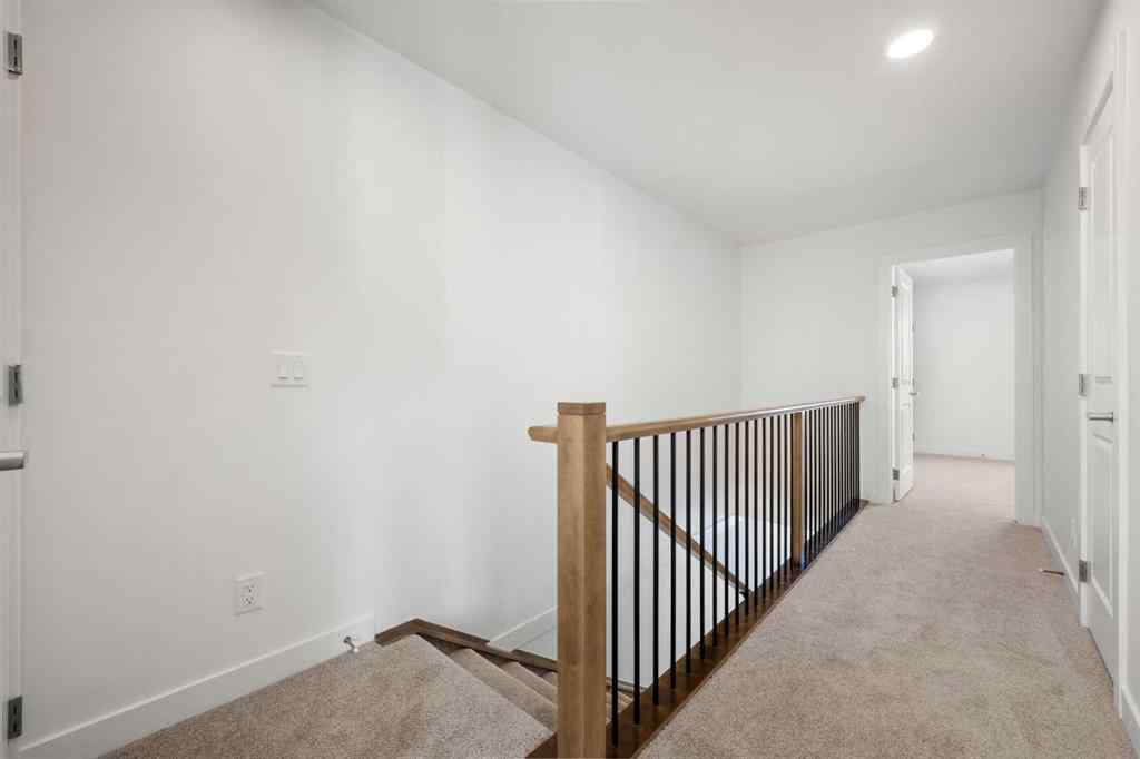 MLS® A2262501 - 8331 8 Avenue SW in West Springs Calgary, Residential