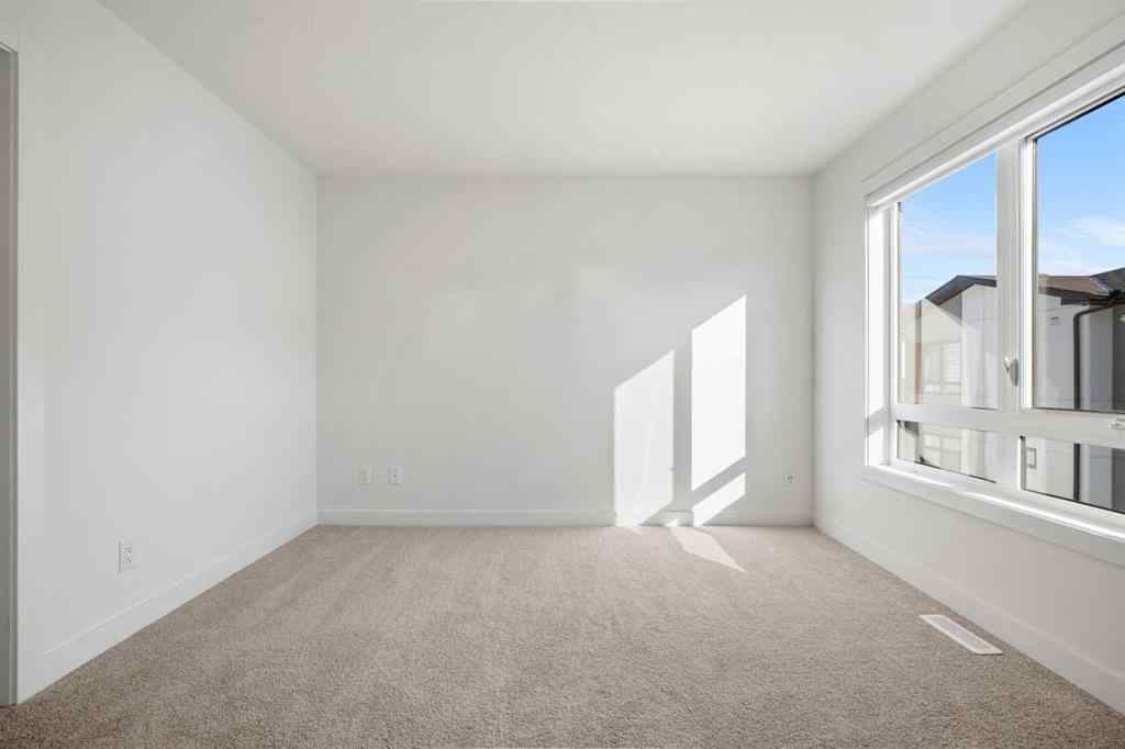 MLS® A2262501 - 8331 8 Avenue SW in West Springs Calgary, Residential