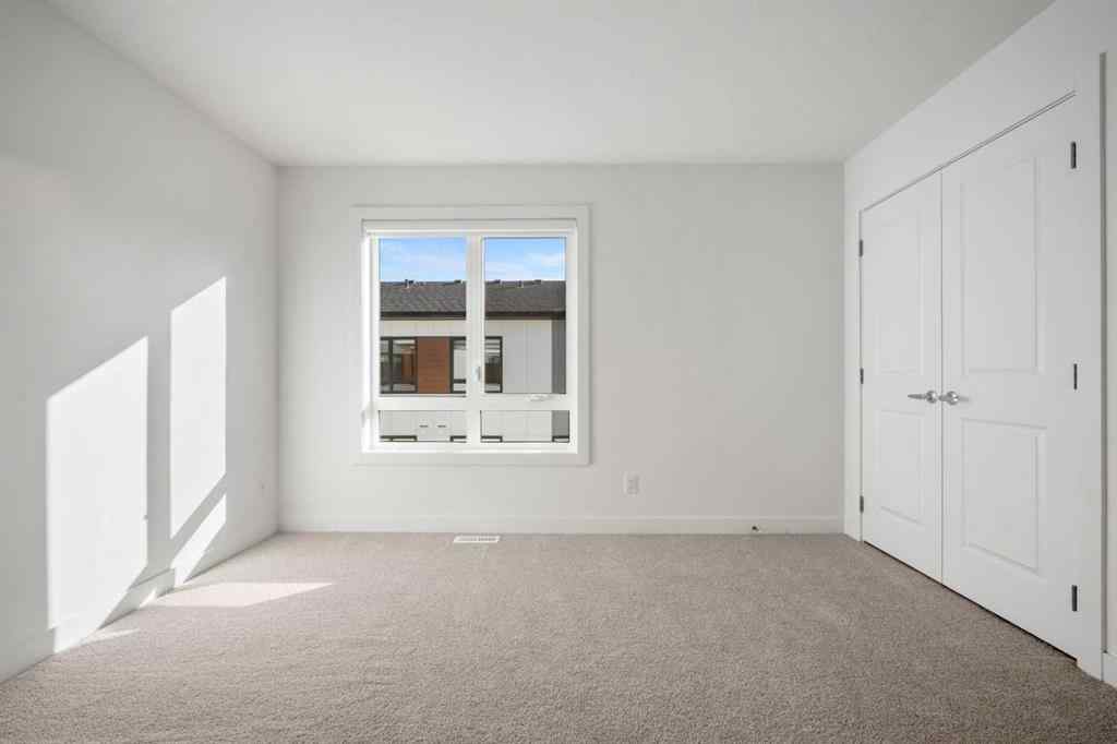 MLS® A2262501 - 8331 8 Avenue SW in West Springs Calgary, Residential