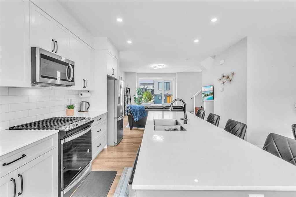 MLS® A2262510 - 203 Evanscrest Square NW in Evanston Calgary, Residential