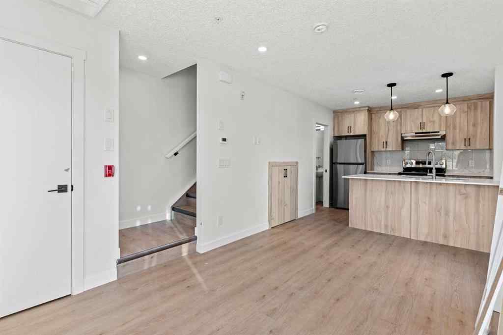 MLS® A2262676 - Unit #109 156 Park Street  in Greystone Cochrane, Residential