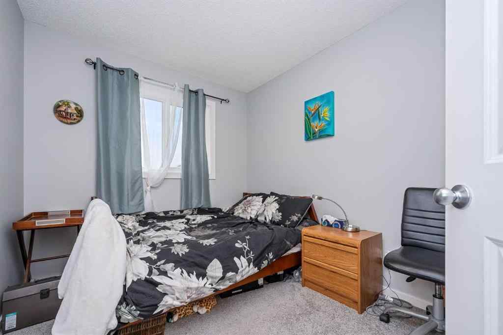 MLS® A2262697 - 229 Belmont Street SW in Belmont Calgary, Residential