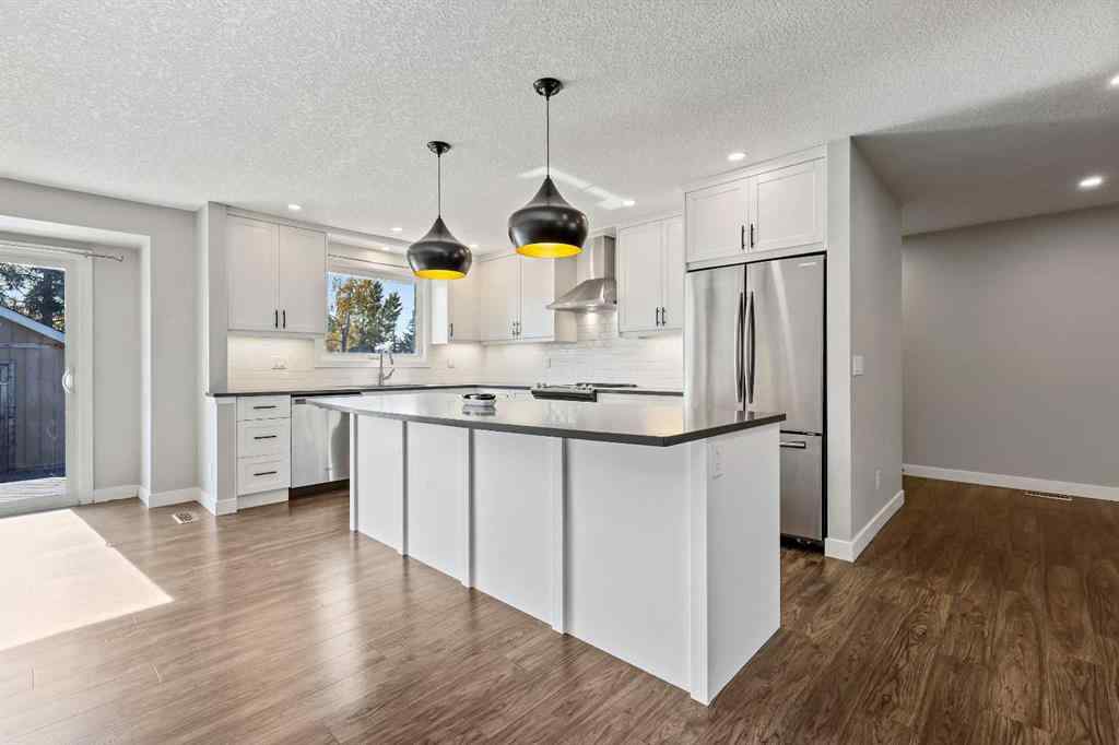 MLS® A2262740 - 2003 117 Avenue SW in Woodlands Calgary, Residential