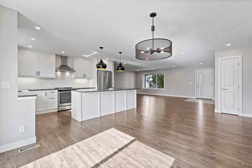 MLS® A2262740 - 2003 117 Avenue SW in Woodlands Calgary, Residential