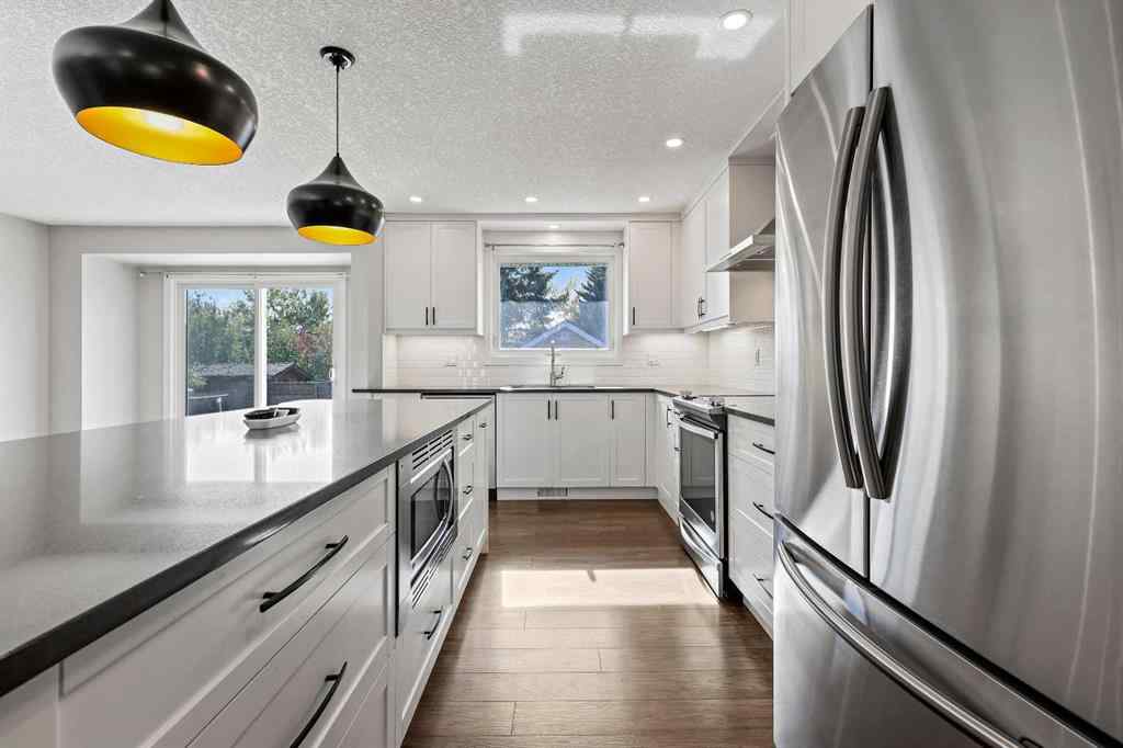 MLS® A2262740 - 2003 117 Avenue SW in Woodlands Calgary, Residential