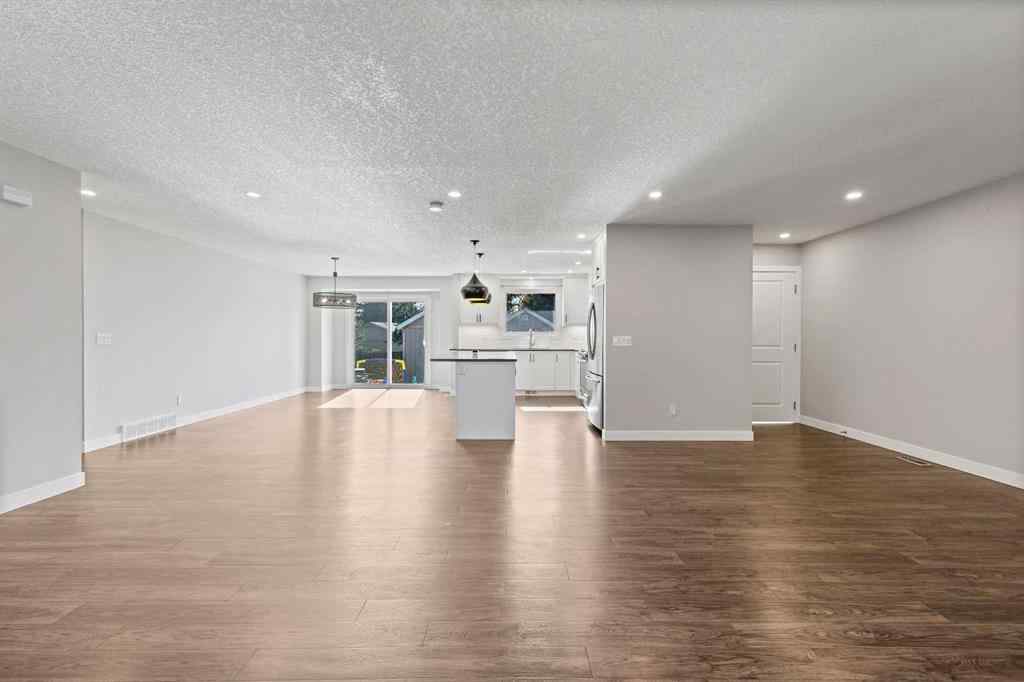 MLS® A2262740 - 2003 117 Avenue SW in Woodlands Calgary, Residential