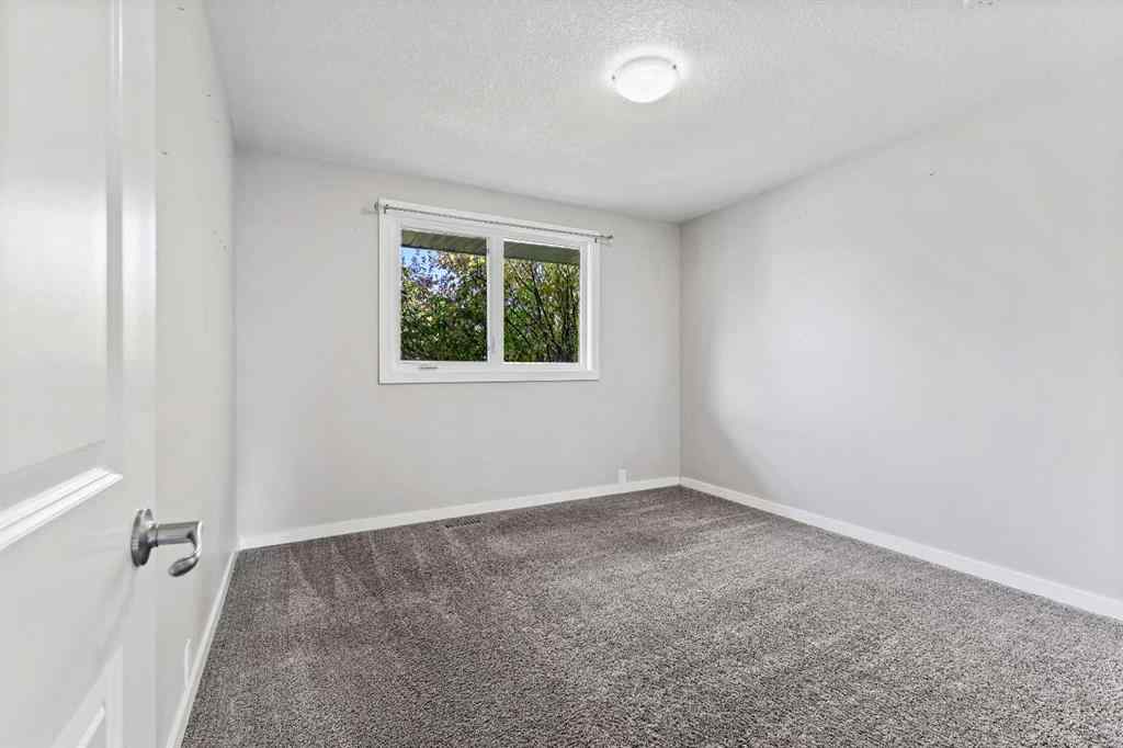 MLS® A2262740 - 2003 117 Avenue SW in Woodlands Calgary, Residential