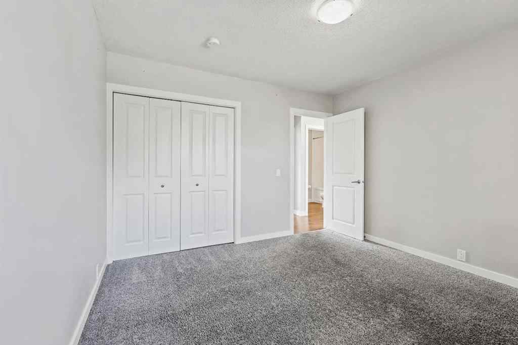 MLS® A2262740 - 2003 117 Avenue SW in Woodlands Calgary, Residential