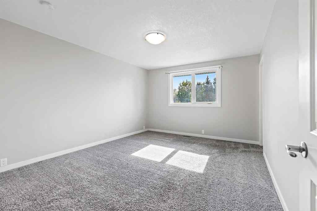 MLS® A2262740 - 2003 117 Avenue SW in Woodlands Calgary, Residential