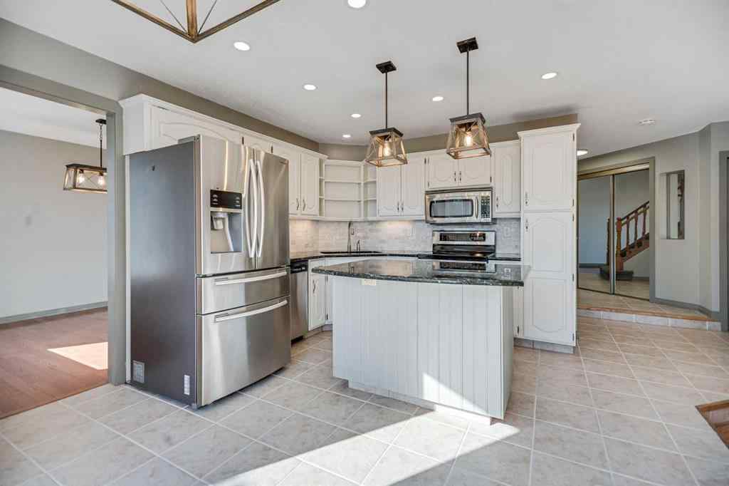 MLS® A2262746 - 107 Wood Valley Drive SW in Woodbine Calgary, Residential