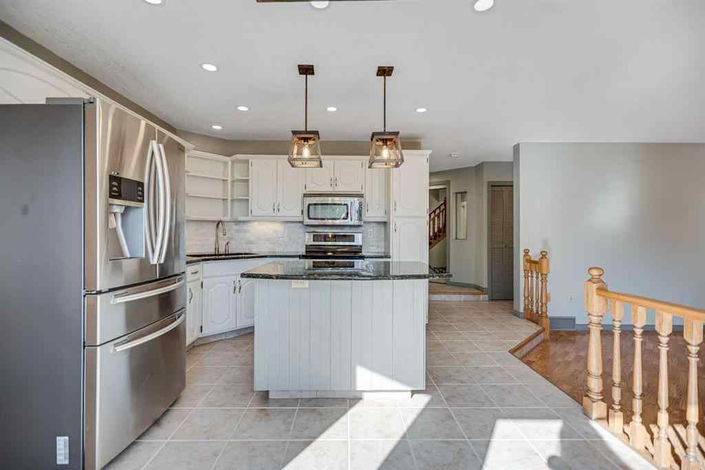 MLS® A2262746 - 107 Wood Valley Drive SW in Woodbine Calgary, Residential