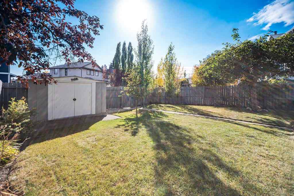 MLS® A2262746 - 107 Wood Valley Drive SW in Woodbine Calgary, Residential