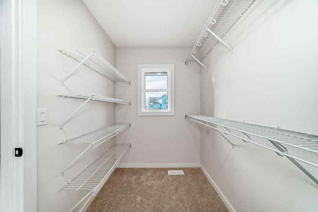 MLS&reg; # A2262818 - 19750 Sheriff King Street SW in Belmont Calgary, Residential Open Houses