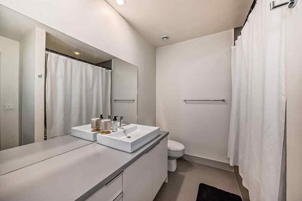 MLS® A2262899 - Unit #204 1707 27 Avenue SW in South Calgary Calgary, Residential