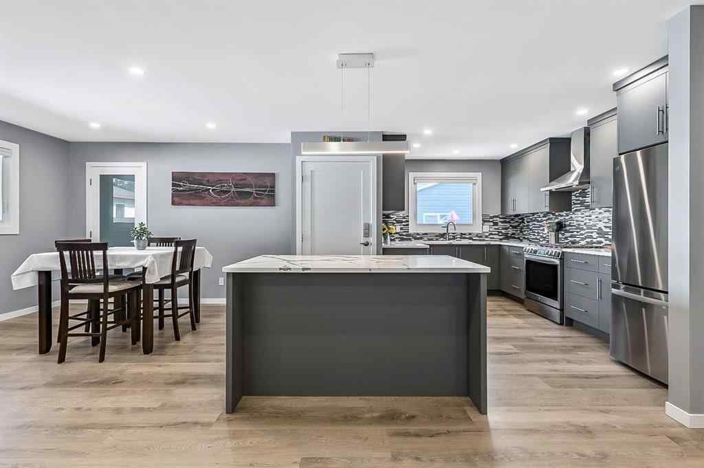 MLS® A2262916 - 128 Queen Alexandra Close SE in Queensland Calgary, Residential