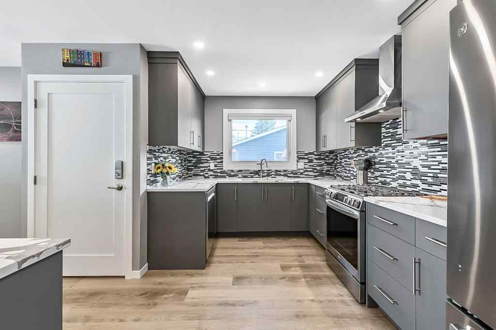 MLS® A2262916 - 128 Queen Alexandra Close SE in Queensland Calgary, Residential