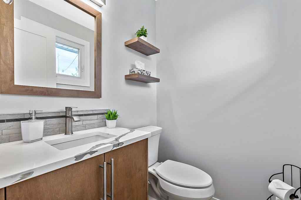 MLS® A2262916 - 128 Queen Alexandra Close SE in Queensland Calgary, Residential