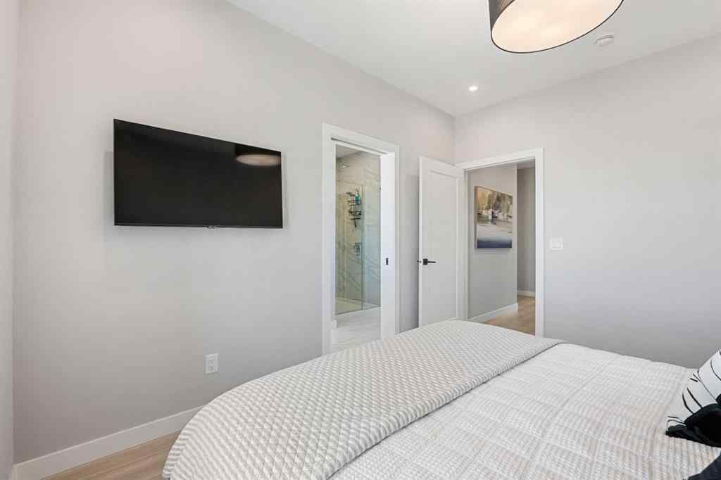 MLS® A2262942 - 8149 8 Avenue SW in West Springs Calgary, Residential