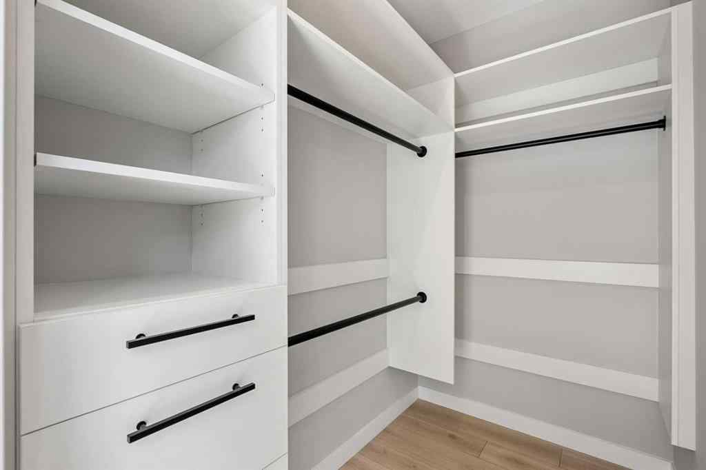 MLS® A2262942 - 8149 8 Avenue SW in West Springs Calgary, Residential