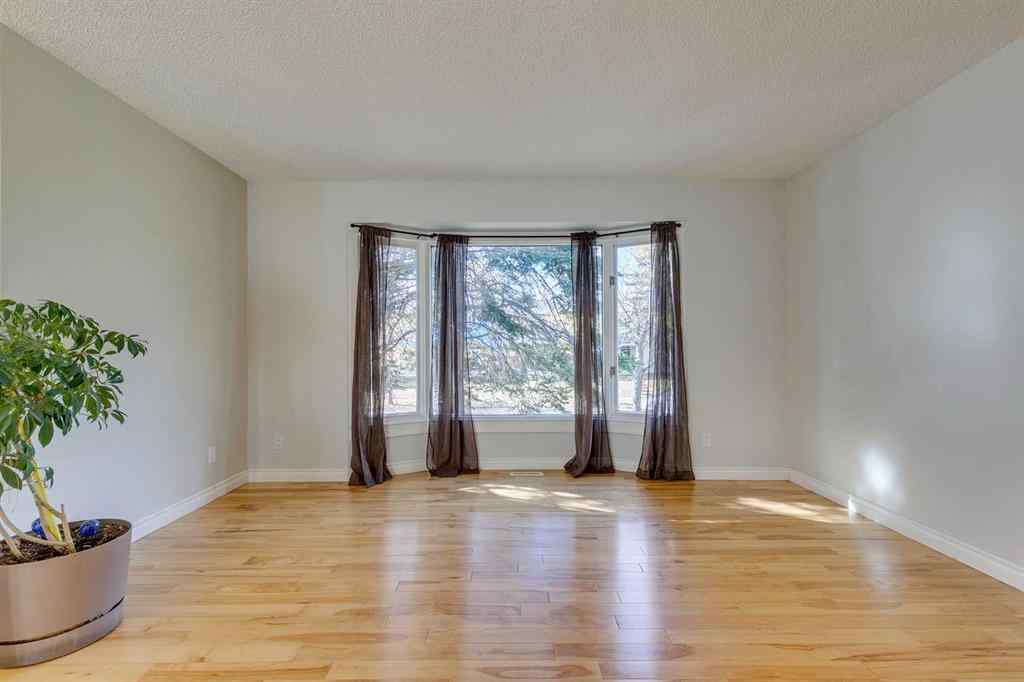 MLS® A2262950 - 108 Sunbank Way SE in Sundance Calgary, Residential