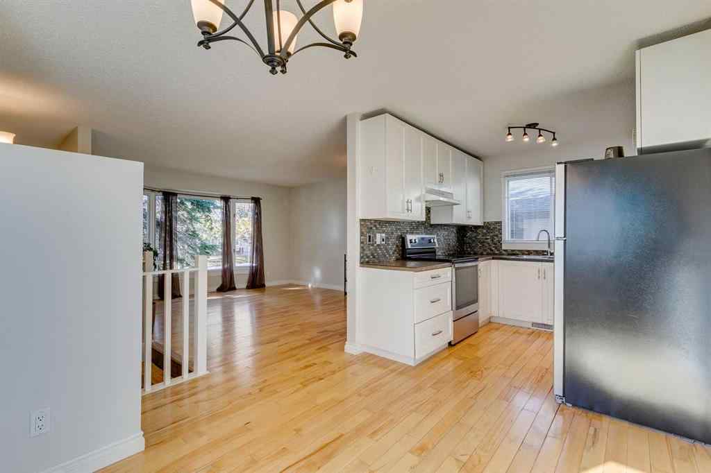 MLS® A2262950 - 108 Sunbank Way SE in Sundance Calgary, Residential
