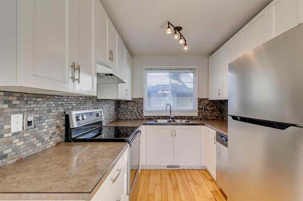 MLS® A2262950 - 108 Sunbank Way SE in Sundance Calgary, Residential