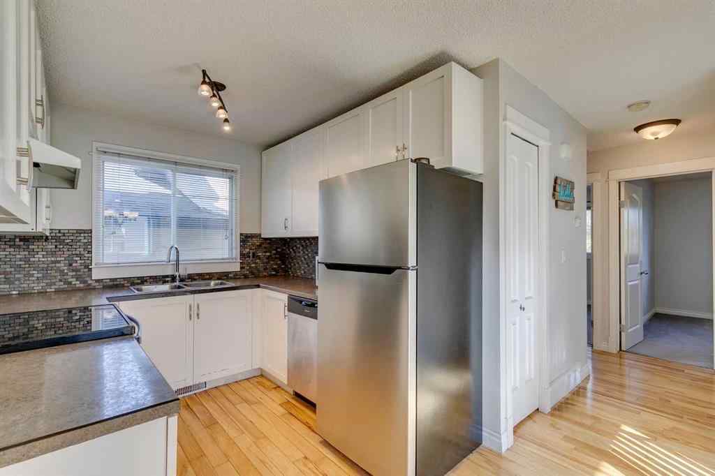 MLS® A2262950 - 108 Sunbank Way SE in Sundance Calgary, Residential