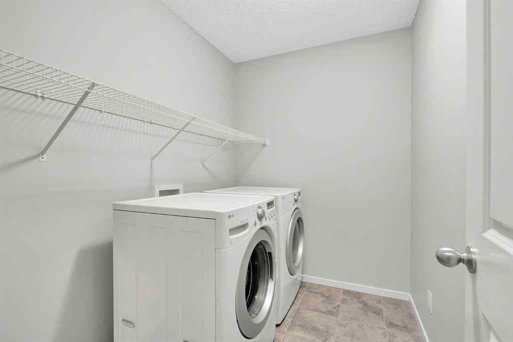 MLS® A2263068 - 106 Lucas Crescent NW in Livingston Calgary, Residential