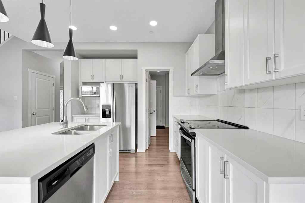 MLS® A2263068 - 106 Lucas Crescent NW in Livingston Calgary, Residential