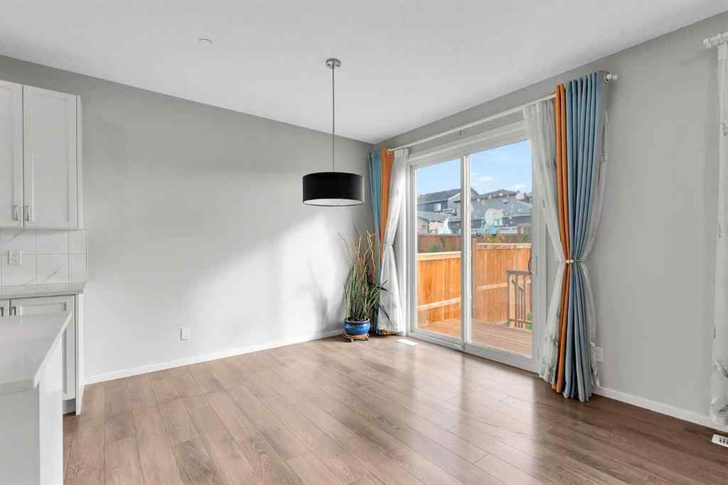 MLS® A2263068 - 106 Lucas Crescent NW in Livingston Calgary, Residential