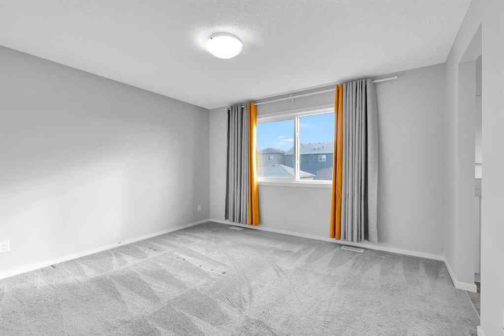 MLS® A2263068 - 106 Lucas Crescent NW in Livingston Calgary, Residential