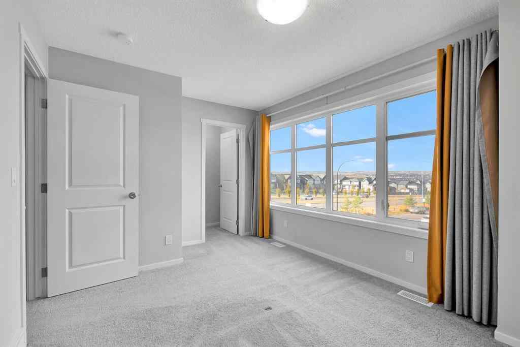 MLS® A2263068 - 106 Lucas Crescent NW in Livingston Calgary, Residential