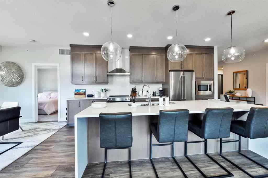 MLS® A2263109 - Unit #415 8355 19 Avenue SW in Springbank Hill Calgary, Residential