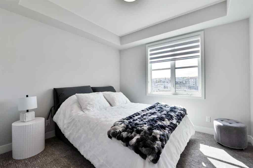 MLS® A2263109 - Unit #415 8355 19 Avenue SW in Springbank Hill Calgary, Residential