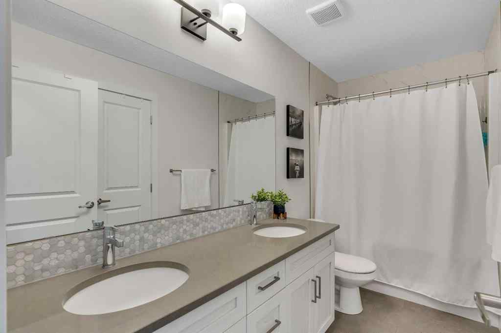 MLS® A2263179 - 2173 Ravensdun Crescent SE in Ravenswood Airdrie, Residential