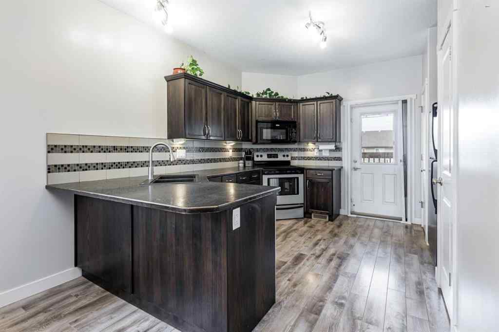 MLS® A2263259 - 45 Coachman Way  in Cottonwood Estates Blackfalds, Residential